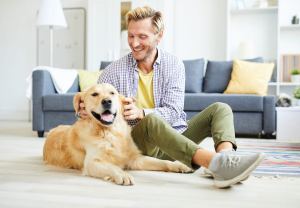 Man Playing with Dog - Kelowna Mortgage Brokers