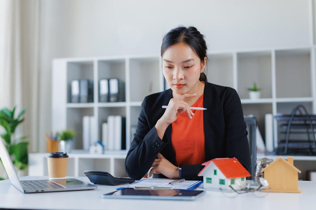 Businesswoman evaluating real estate investment