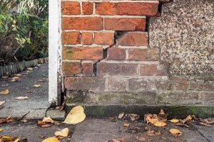 Cracked brick wall in need of repair