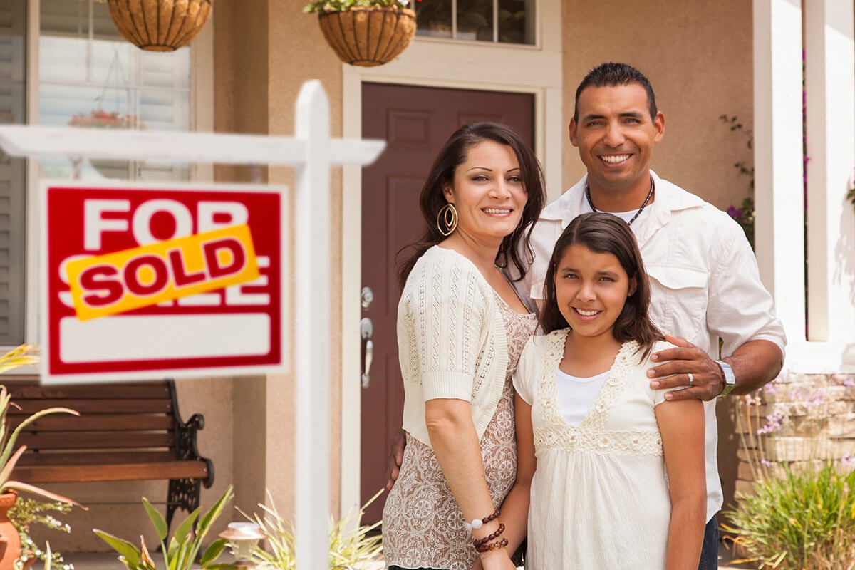 Family in Front of Their New Home