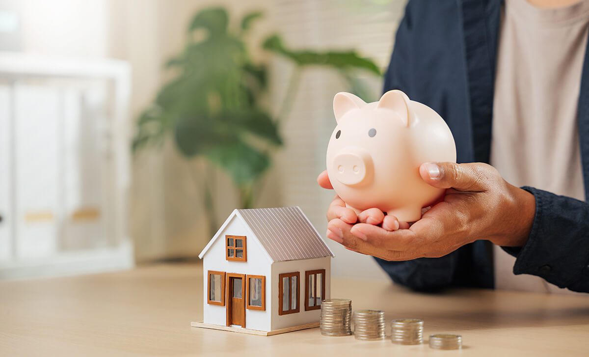 a piggy bank and house model
