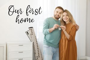 happy young couple with key in their new house