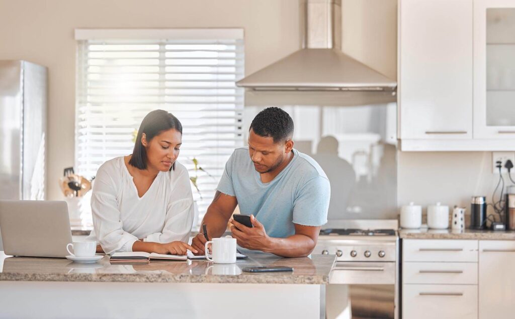 Couple going over paperwork together at home