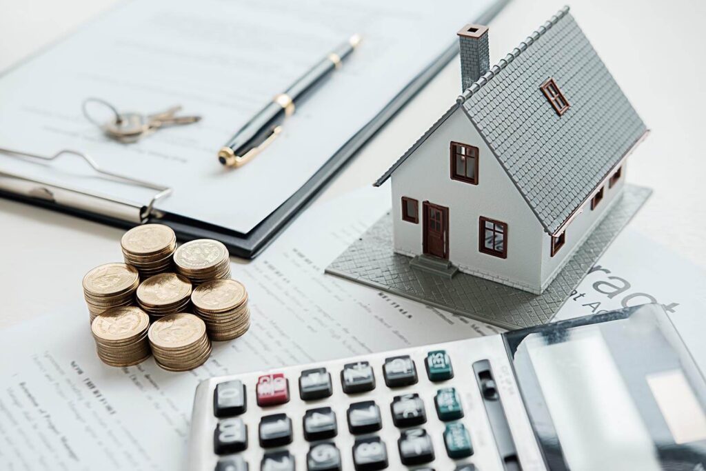 House model with real estate agent and customer