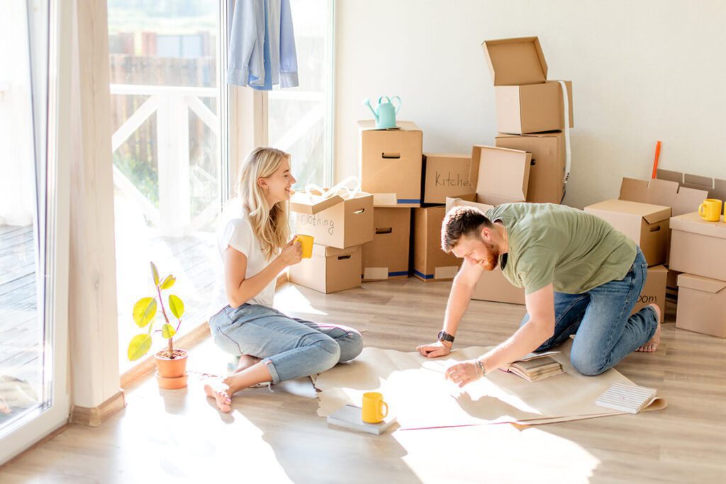 Portrait of happy caucsian couple planning new house