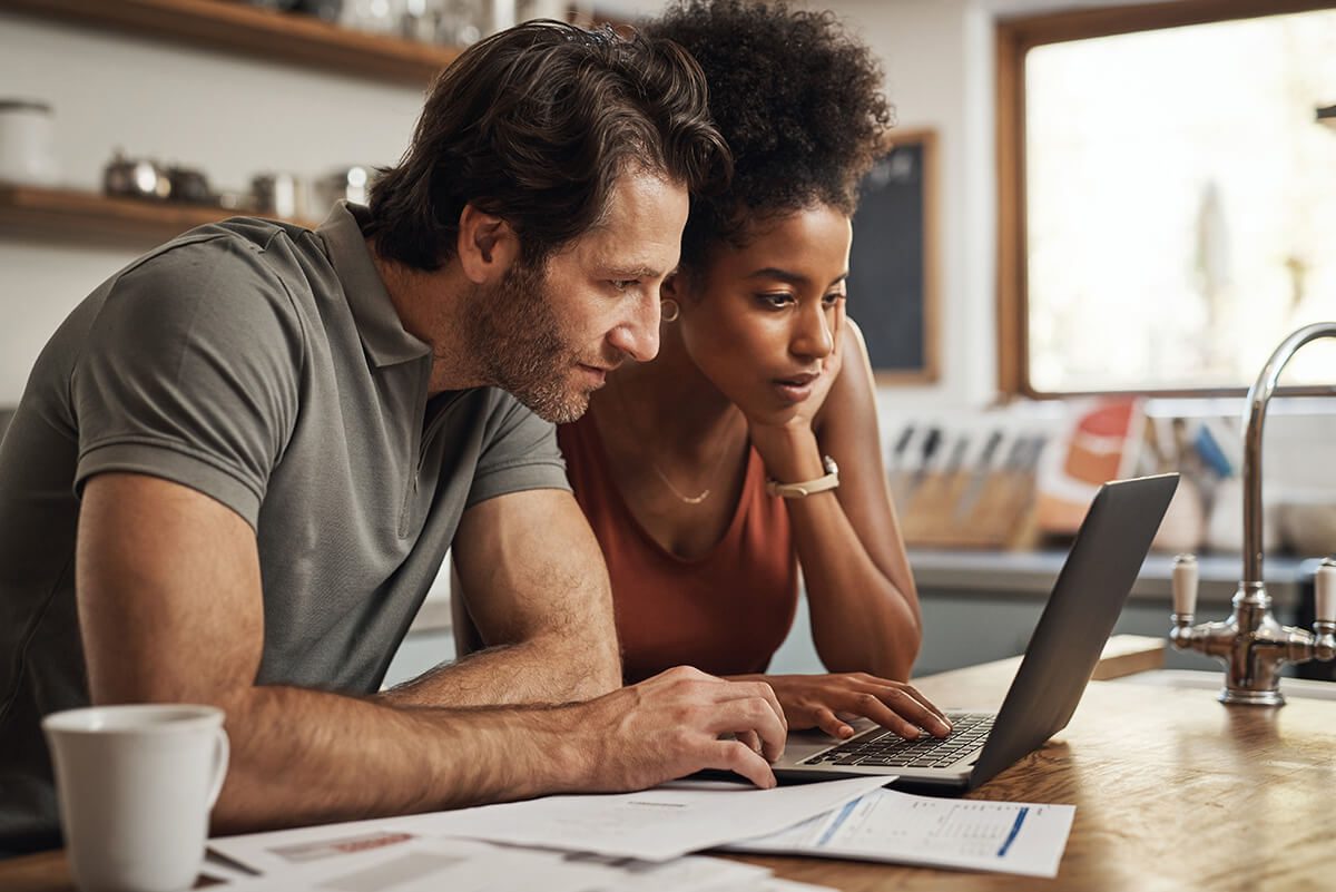 a couple using their laptop