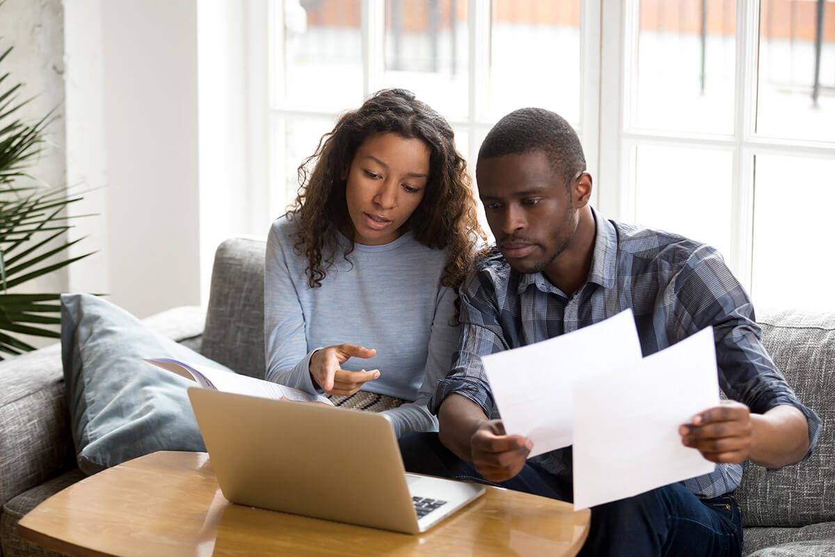 couple discussing paper documents