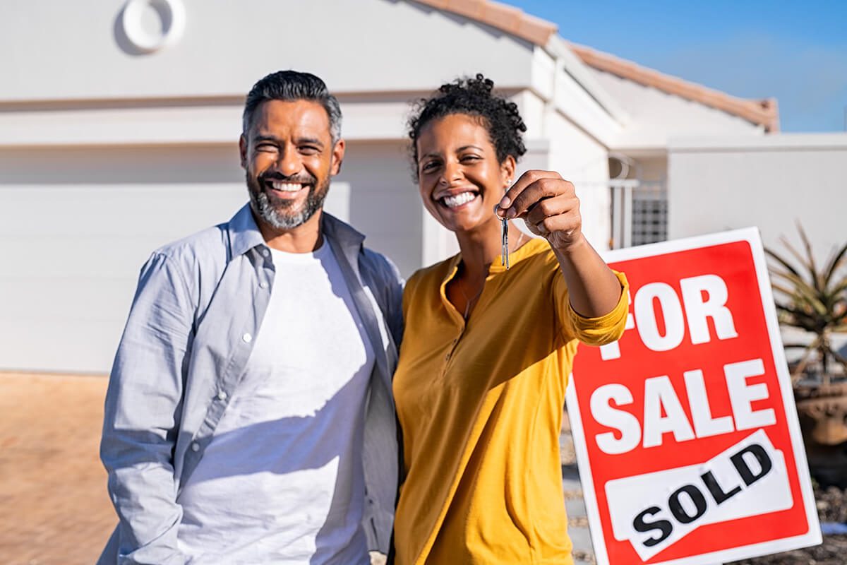 couple holding new house keys